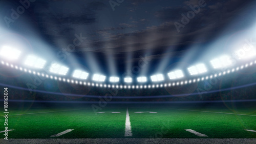 American football field illuminated by stadium lights