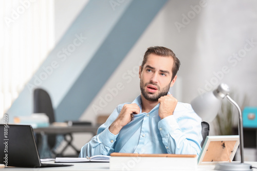 Young man suffering from he...