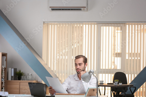 Young man working in office...