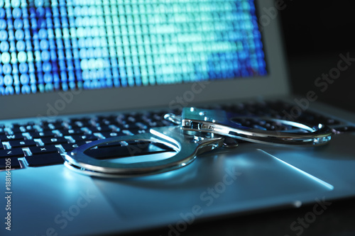 Handcuffs on laptop keyboar...