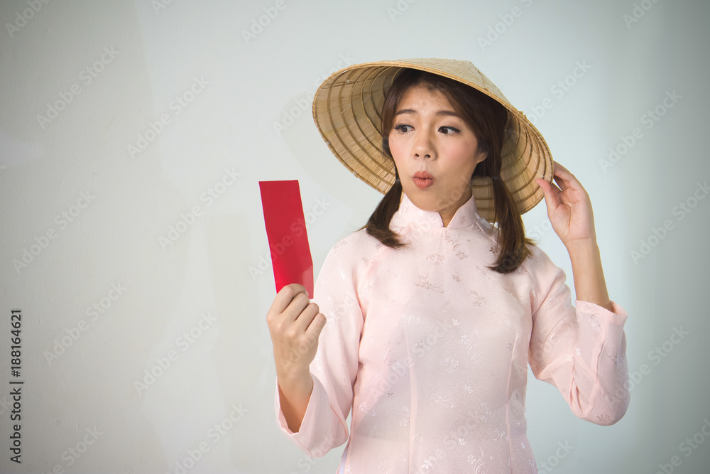 Vietnam woman holding red envelope, woman wear Vietnamese, Vietnamese new year