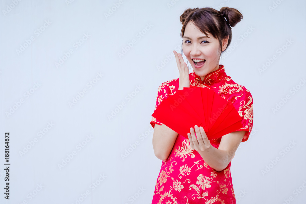Asian woman holding red envelope, woman wear cheongsam, chinese new year Asian woman holding red envelope, woman wear cheongsam, chinese new year