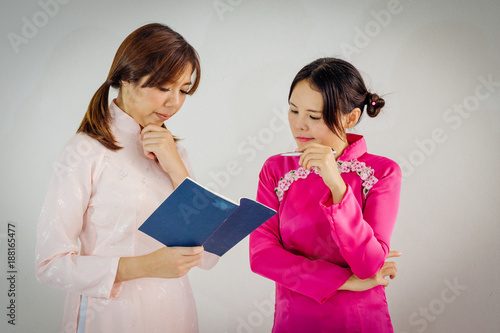 Two university students studying together photo