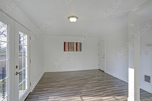 Empty dining room. Pure white walls make the room spacious