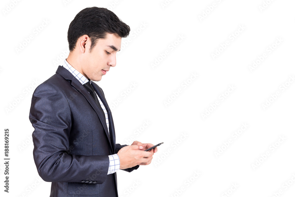 Businessman in elegant black suit using smartphone isolated on white background