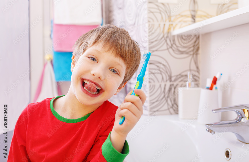Little funny boy with a funny expression on his face in the bathroom Little funny boy with a funny expression on his face in the bathroom
