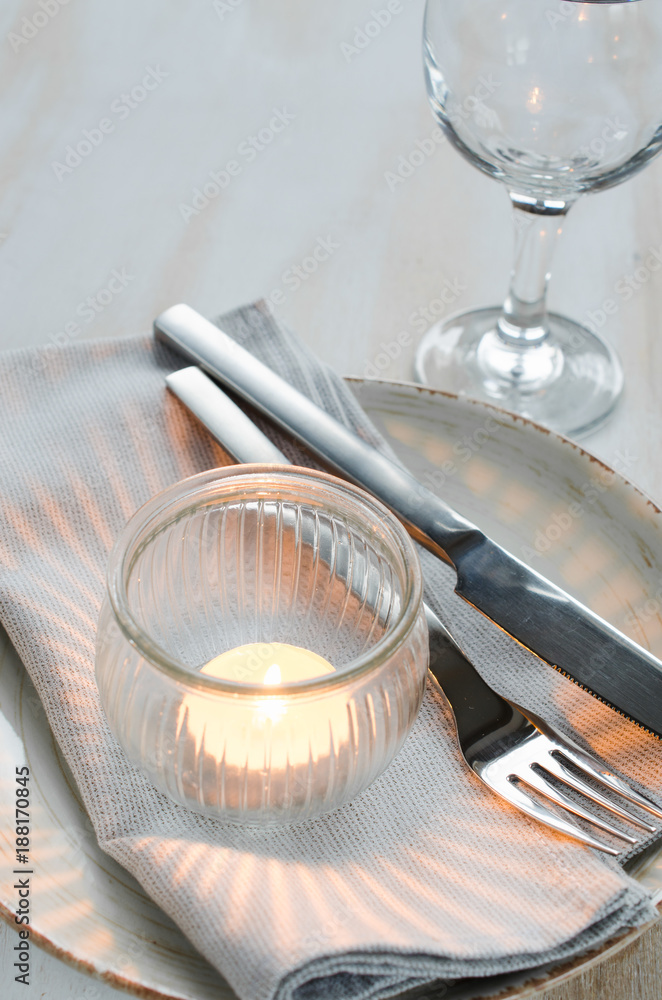 Festive table setting with candle.