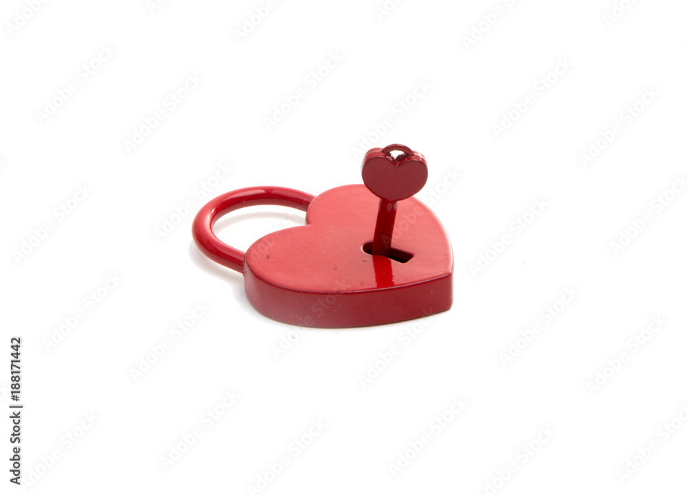 metalic red heart with a key on the white metalic red heart with a key on the white