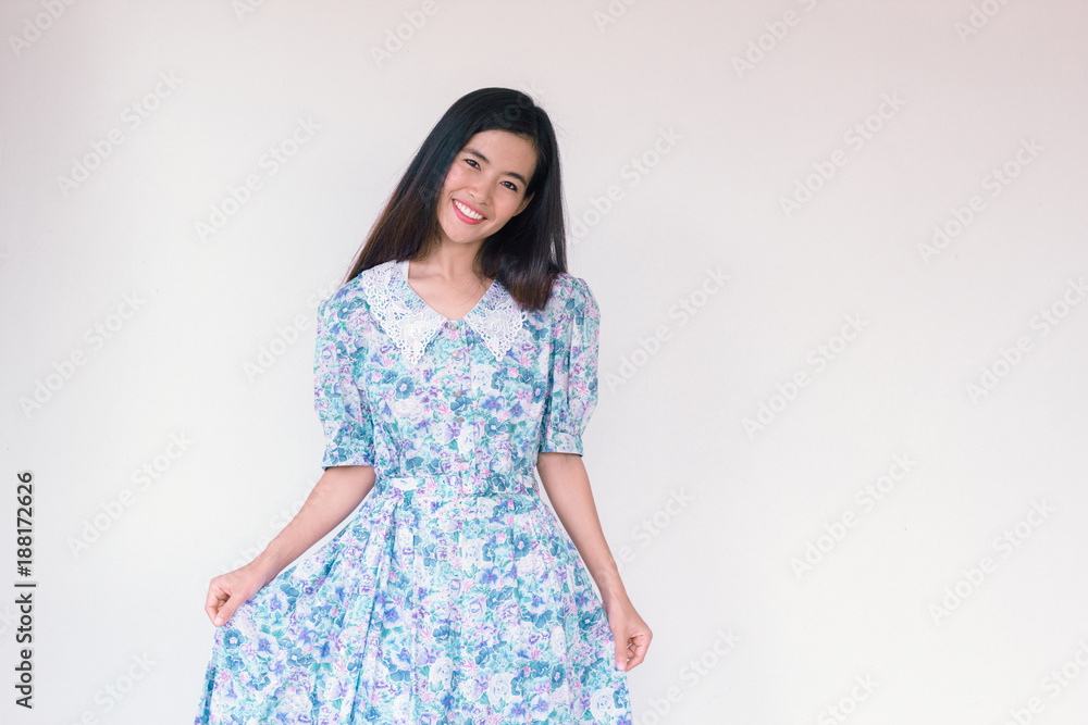 Fashion Portrait of Young cute asian woman wearing vintage blue dress and pointing up Fashion Portrait of Young cute asian woman wearing vintage blue dress and pointing up