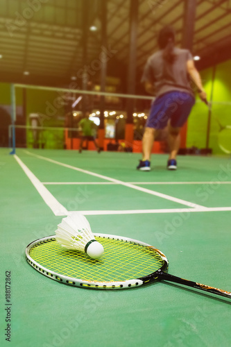 badminton courts with shuttlecocks in the foreground