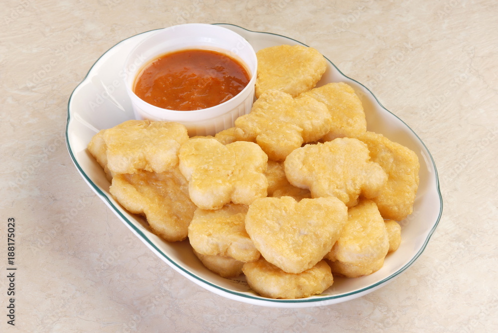 Fried chicken nuggets on a plate Fried chicken nuggets on a plate