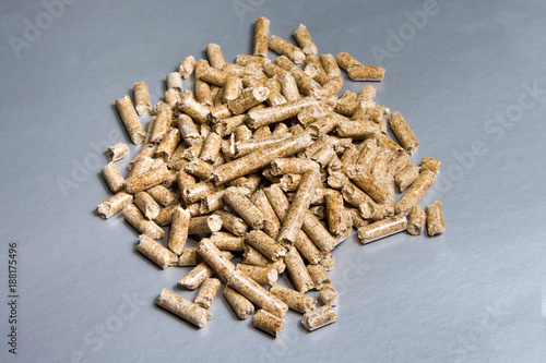 Wood pellets on a silver background. Biofuels. The Cat Litter