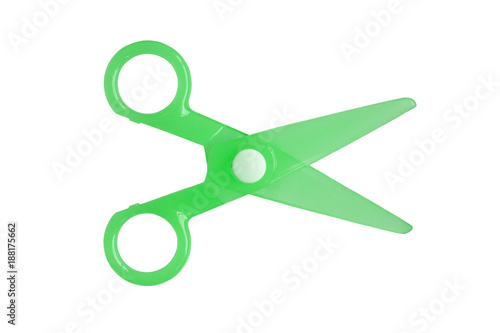 Green Plastic children safety scissors isolated on white background.