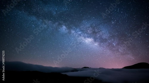 milky way over clouds photo