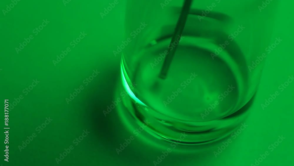 Syringe needle in glass vial. Experimenting with liquid. Syringe needle in glass vial. Experimenting with liquid.