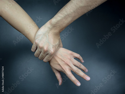 Hand catching others wrist,  getting caught