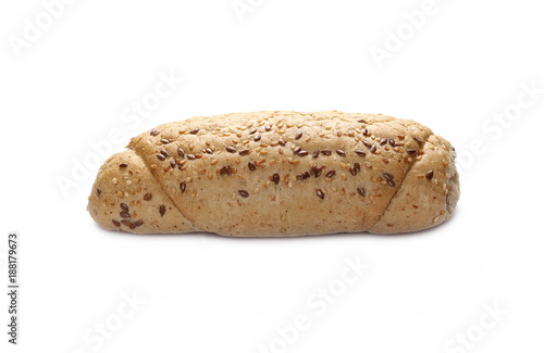 Whole wheat bread roll with sesame and linseed isolated on white background