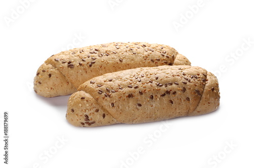 Whole wheat bread roll with sesame and linseed isolated on white background