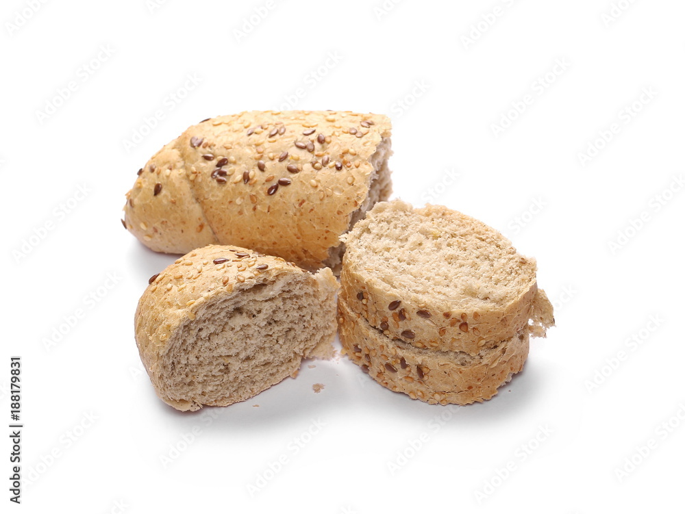 Whole wheat bread roll slices with sesame and linseed isolated on white background Whole wheat bread roll slices with sesame and linseed isolated on white background
