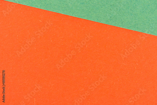 close-up shot of orange and green paper layers for background