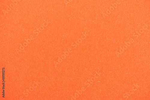 texture of bright orange paper as background