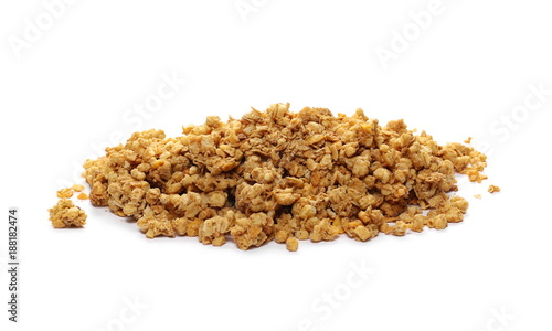 Crunchy granola, muesli pile with peanuts isolated on white background