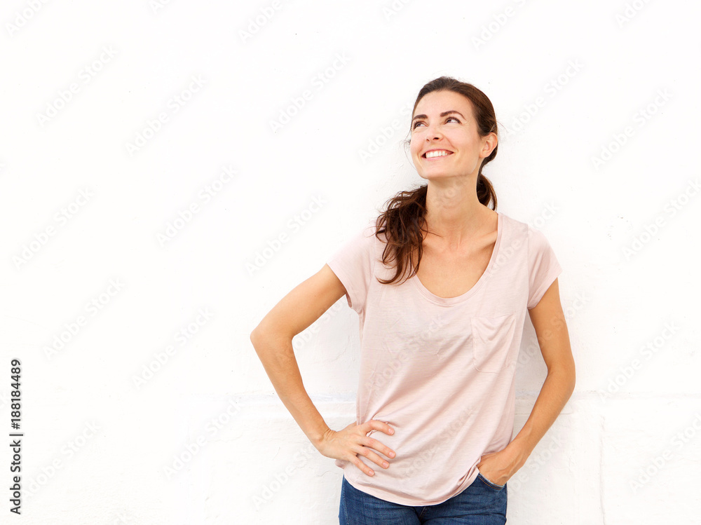 attractive young woman looking away and smiling attractive young woman looking away and smiling