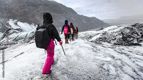 Slika na platnu Group of hiker walk on glacier during snow on Solheimajokull,