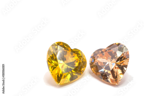 topaz gemstones in heart shape on white background.