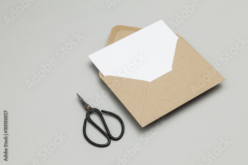 Blank white card with kraft brown paper envelope template mock up