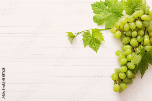 green grape on white wooden background