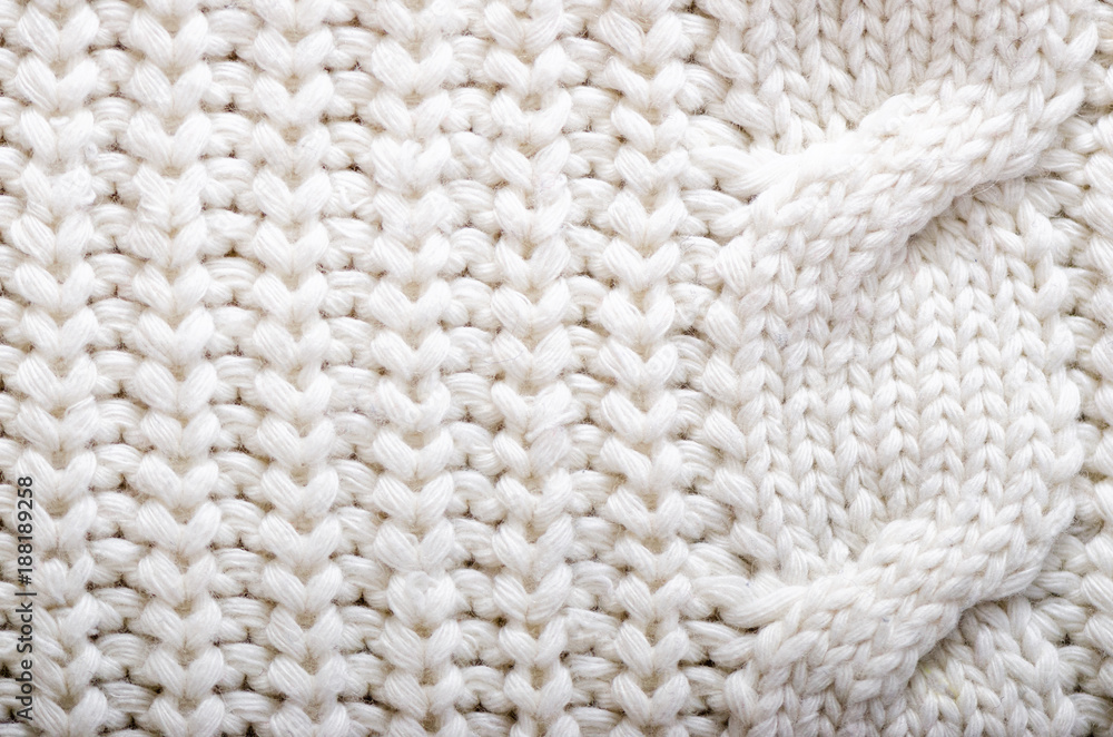 Knitted texture. Pattern fabric made of wool. Background, copy space Knitted texture. Pattern fabric made of wool. Background, copy space