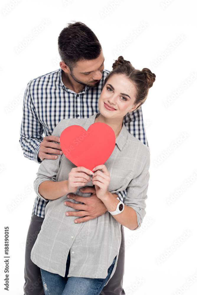 boyfriend hugging girlfriend with paper heart isolated on white, valentines day concept boyfriend hugging girlfriend with paper heart isolated on white, valentines day concept