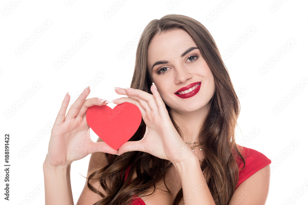 smiling girl in red dress showing paper heart isolated on white, valentines day concept smiling girl in red dress showing paper heart isolated on white, valentines day concept