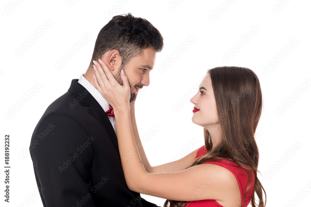 side view of girlfriend touching boyfriends face isolated on white side view of girlfriend touching boyfriends face isolated on white