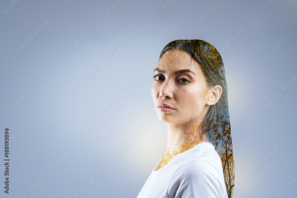 Fall season. Smart skillful tender woman gazing at the camera and finding balance while asking you questions Fall season. Smart skillful tender woman gazing at the camera and finding balance while asking you questions