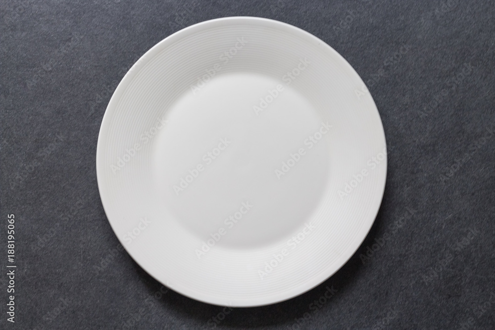 Dinner plate white table setting on dark background Dinner plate white table setting on dark background