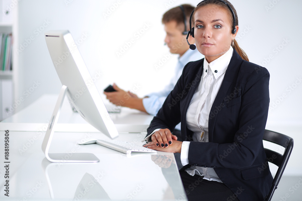 Happy female wearing headset and sitting on the desk . businesswoman . Happy female wearing headset and sitting on the desk . businesswoman .