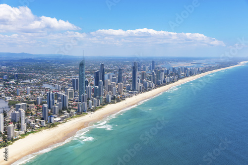 Sunny aerial view of Surfers Paradise looking inland on the Gold Coast © Zstock