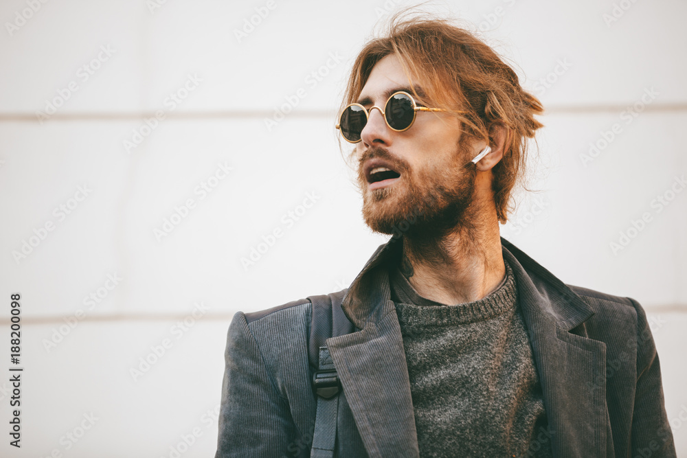 Portrait of an attractive bearded man wearing sunglasses Portrait of an attractive bearded man wearing sunglasses