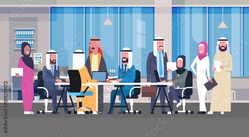 Group Of Arabic Business People Working Together In Office Sit At Desk Muslim Workers Team Brainstorming Meeting Flat Vector Illustration