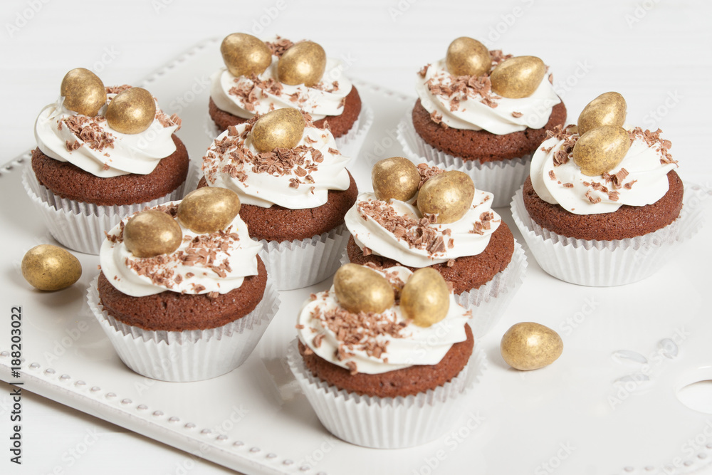 Easter Cupcakes Decorated With Golden Chocolate Eggs. Home Baked. Easter Cupcakes Decorated With Golden Chocolate Eggs. Home Baked.