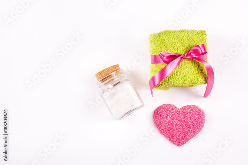 Terry towel, soap heart and sea salt on white background. Spa concept. Romantic concept.