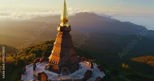 Cinematic aerial view of Buddhist temple at sunrise