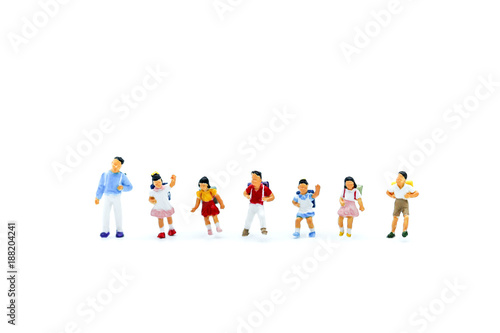 Miniature people : children with book and school background. Back to school concept