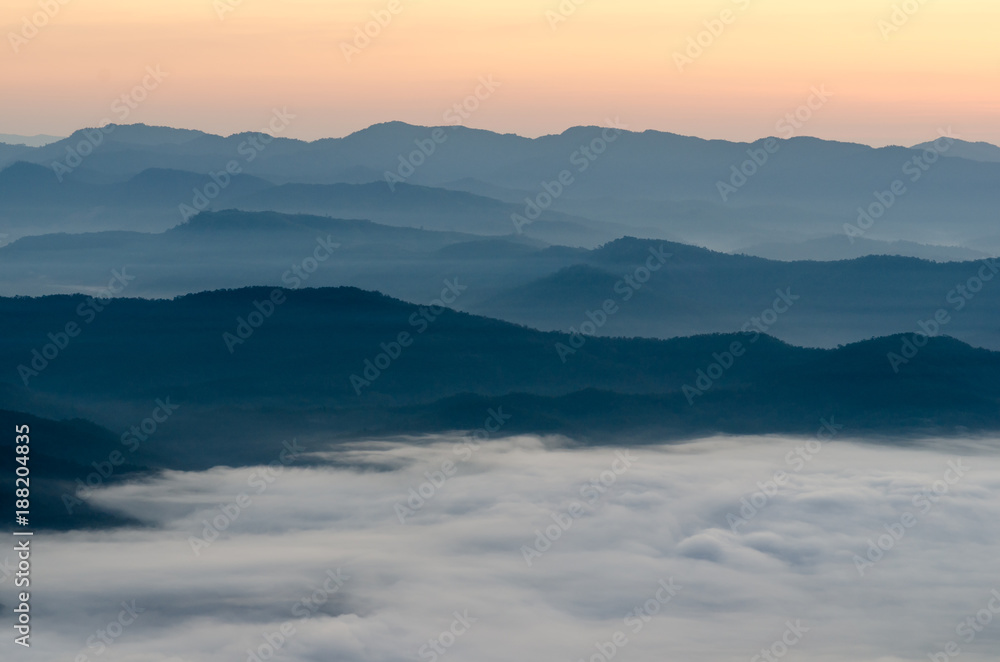 Sunset over mountains and fog. Start the first day of Easter day