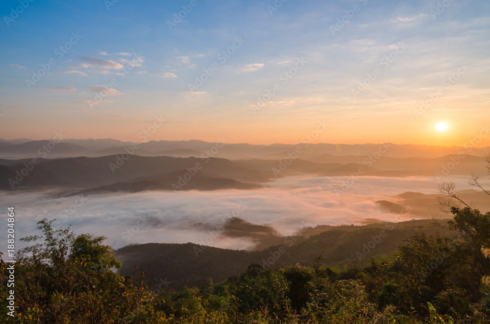 Sunset over mountains and fog. Start the first day of Easter day