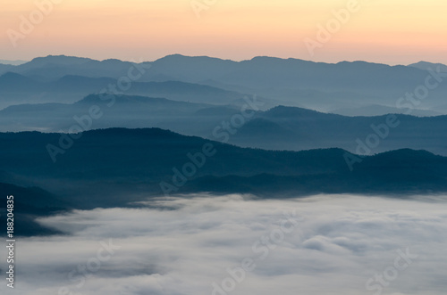 Sunset over mountains and fog. Start the first day of Easter day © NIPATHORN