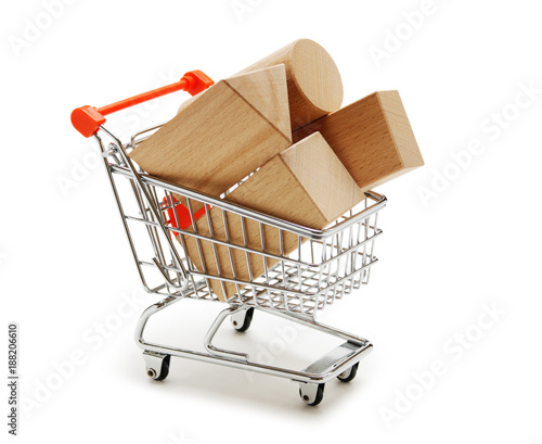 wooden blocks for the construction in shopping trolley isolated on a white