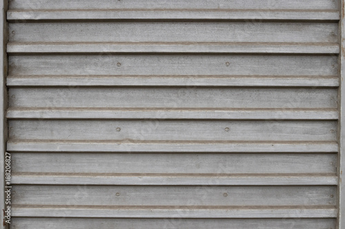 Background image of a sheet of iron with horizontal stripes.
